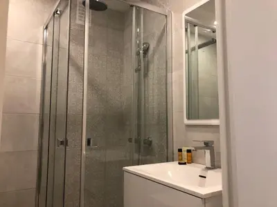 a bathroom with a shower and a sink at C001-Beau studio neuf situé au centre in Cannes