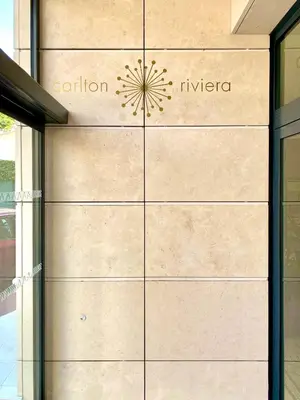 a metal door with the name of a building at Carlton Riviera in Cannes