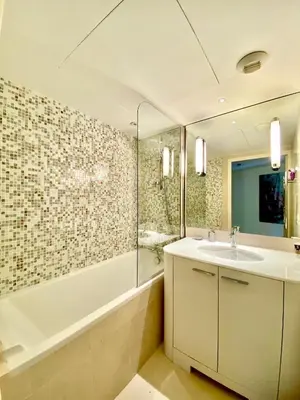 a bathroom with a sink and a shower and a tub at Carlton Riviera in Cannes