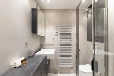 a bathroom with a sink and a shower at Blue Dreams YourHostHelper in Cannes