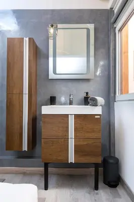 a bathroom with a sink and a mirror at Duplex : Plage 300m, Clim, Netflix in Cannes
