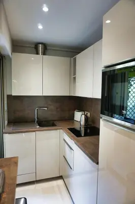 a bathroom with a white sink and a mirror at Studio Cannes center next to Croisette and rue d'Antibes in Cannes