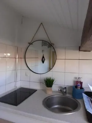 a bathroom with a sink and a mirror at Gatsby Cannes Croisette in Cannes
