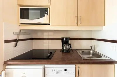 a kitchen with a sink and a microwave at Résidence Cannes Villa Francia - maeva Home - Appartement 2 Pièces 4 Personnes - Budget MAE-6120 in Cannes
