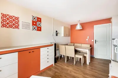 a kitchen and dining room with a table and chairs at Résidence Cannes Villa Francia - maeva Home - Appartement 2 Pièces 6 Personnes - Budget MAE-6123 in Cannes