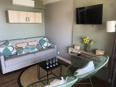a living room with a couch and two chairs at Résidence Cannes Villa Francia - maeva Home - Appartement 2 pièces 6 personnes avec très belle vue mer - Prestige - super Home MAE-6260 in Cannes