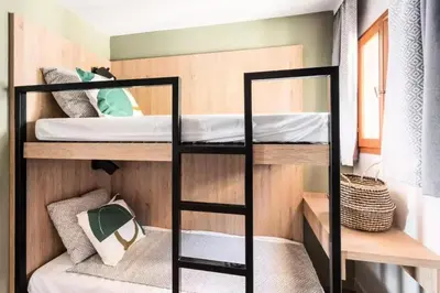 a bunk bed in a small room with a bunk bed in a bedroom at Résidence Cannes Villa Francia - maeva Home - Appartement 2 pièces 6 personnes avec très belle vue mer - Prestige - super Home MAE-6260 in Cannes