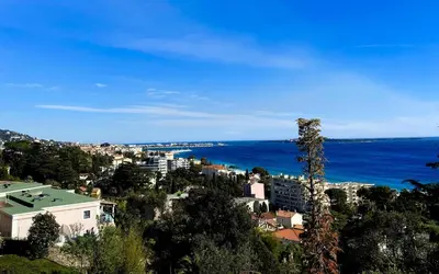 a view of a city and the ocean at Résidence Cannes Villa Francia - maeva Home - Appartement 2 pièces 6 personnes avec très belle vue mer - Prestige - super Home MAE-6260 in Cannes