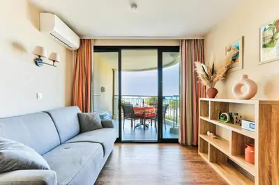a living room with a couch and a view of the ocean at Résidence Cannes Villa Francia - maeva Home - Studio 4 personnes - Sélection MAE-6353 in Cannes