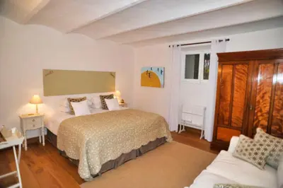 a bedroom with a bed and a couch in it at Ref ROSE - Palmes d'Or Properties in Cannes