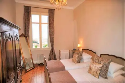 a bedroom with two beds and a window at Ref ROSE - Palmes d'Or Properties in Cannes