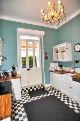 a kitchen with a black and white checkered floor at Ref ROSE - Palmes d'Or Properties in Cannes
