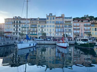 a group of boats docked in a harbor with buildings at Cannes Old Port, SEAFRONT & SEAVIEWS new reversible air conditioning in Cannes