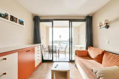 a living room with a couch and a table at Résidence Cannes Villa Francia - maeva Home - Appartement 2 pièces 4 personnes - Sélection MAE-6529 in Cannes