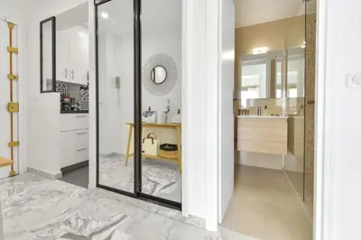 a bathroom with a glass shower and a sink at Cannes Palm Beach district 2 min to the beaches in Cannes