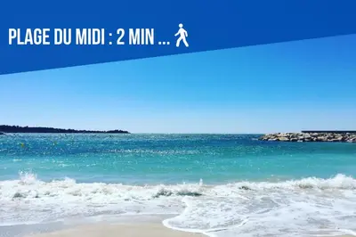 a picture of the ocean with a person walking on the beach at Le Dol - 150m plages - Suquet - Verrière Côte d'azur in Cannes