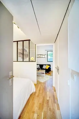 a bedroom with a bed and a living room at Le Dol - 150m plages - Suquet - Verrière Côte d'azur in Cannes