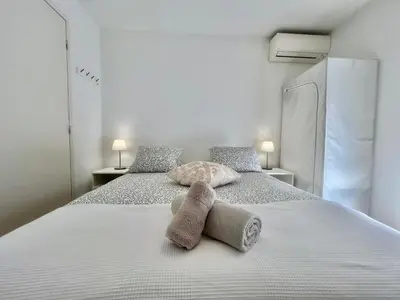 a bedroom with a bed with two towels on it at Parc Eugenie by Welcome to Cannes in Cannes