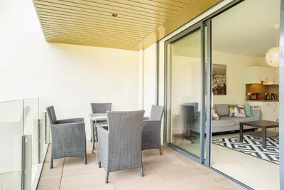 a dining room with a table and chairs at Parc Eugenie by Welcome to Cannes in Cannes