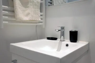 a white sink in a bathroom with a mirror at C005-Studette au centre Cannes in Cannes