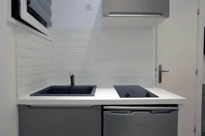a kitchen with a sink and a counter top at C005-Studette au centre Cannes in Cannes