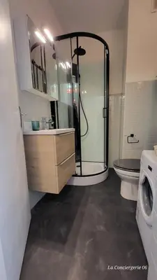 a bathroom with a shower and a toilet and a sink at CANNES STUDIO - wifi, clim in Cannes