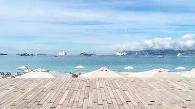 a view of a beach with boats in the water at CANNES STUDIO - wifi, clim in Cannes