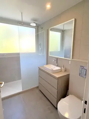 a bathroom with a toilet and a sink and a shower at Solezia appartement, piscine et vue mer, by Welcome to Cannes in Cannes