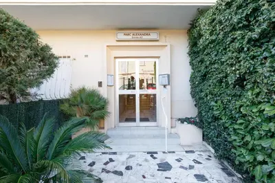 a sign that reads the front door of a building at Alexandra YourHostHelper in Cannes