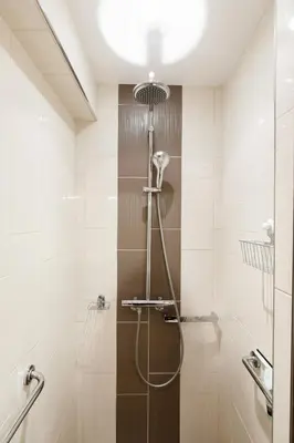 a shower with a glass door in a bathroom at Alexandra YourHostHelper in Cannes