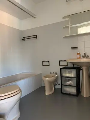 a bathroom with a toilet and a sink at Cannes Standing proche Croisette in Cannes