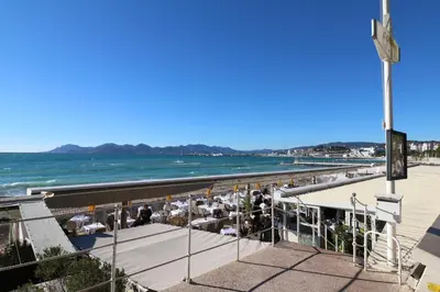 a view of the beach from the pier at Beautiful studio at the Grand Hotel Residence with sunny balcony 138 in Cannes