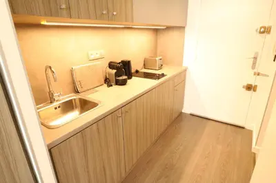 a kitchen with a sink and a counter top at Beautiful studio at the Grand Hotel Residence with sunny balcony 138 in Cannes