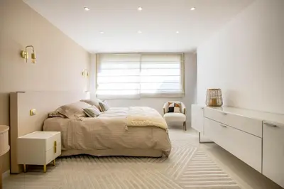 a white bedroom with a bed and a window at Agence des Résidences - Appartements privés du 45 CROISETTE- Prestige in Cannes