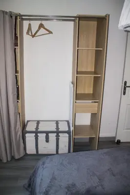 a room with a closet with a book shelf at Appartement palais plages in Cannes