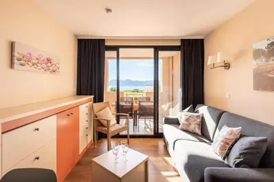 a living room with a couch and a table at Résidence Cannes Villa Francia - maeva Home - Appartement 2 pièces 6 personnes - Sélection MAE-6118 in Cannes