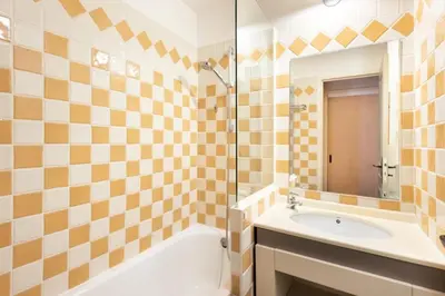 a bathroom with a tub and a sink and a mirror at Résidence Cannes Villa Francia - maeva Home - Appartement 2 pièces 6 personnes - Sélection MAE-6118 in Cannes