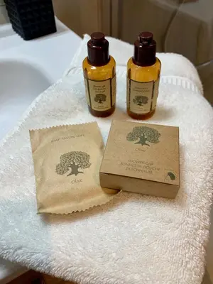 two bottles of essential oils sitting on top of a towel at Magnifique 3 pièces en plein cœur de Cannes in Cannes