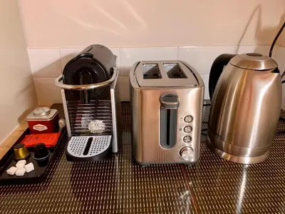 a kitchen counter with a coffee maker and a blender at Magnifique 3 pièces en plein cœur de Cannes in Cannes