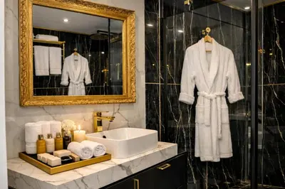 a bathroom with a sink and a mirror at Luxury Maubourg - Vue mer - Croisette 50m plage - Clim - terrasse in Cannes