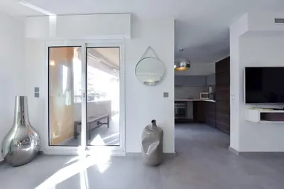 a white room with vases on the floor at 3-Br Apartment 3 minutes to the Croisette in Cannes