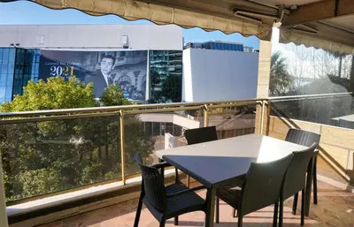 a table and chairs on a balcony with a view at LEM5D - Palmes d'Or Properties in Cannes