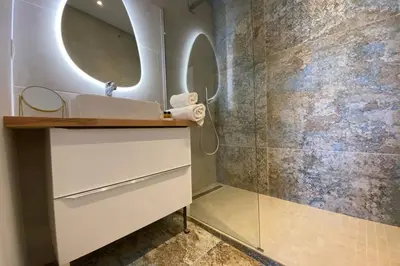 a bathroom with a sink and a mirror at C016-Magnifique appartement de standing au coeur du Suquet in Cannes
