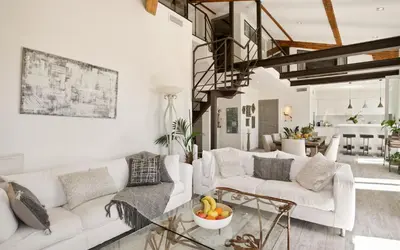 a living room with a white couch and a table at Duplex ForVille in Cannes