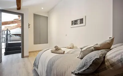 a bedroom with a bed with two stuffed animals on it at Duplex ForVille in Cannes