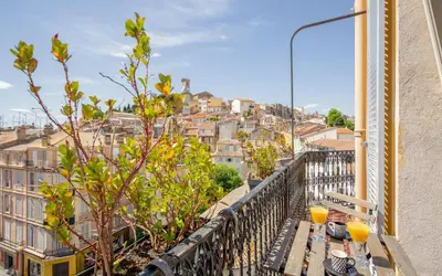 a balcony with a view of a city at Duplex ForVille in Cannes