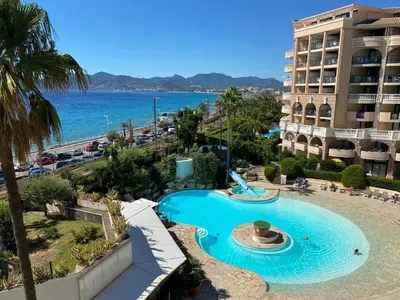 a view of a swimming pool at a resort at Résidence La Palme d'Azur - Petersen App 610 in Cannes
