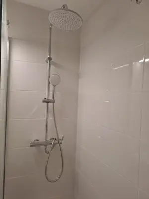 a shower with a shower head in a bathroom at Résidence La Palme d'Azur - Petersen App 610 in Cannes