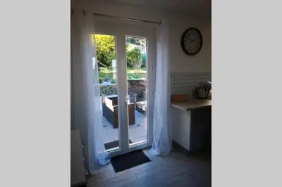 a room with a sliding glass door to a patio at Jolie petite Maison de Charme dans quartier boisé in Vallauris
