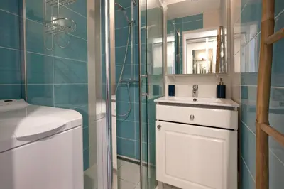 a bathroom with a sink and a shower at Appartement Wester - Welkeys in Cannes